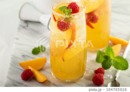 Colorful refreshing cold summer drink with peaches 104785028