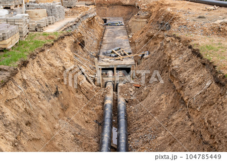 Pipes for heating water in the ground Pipes for heating water in the ground 104785449