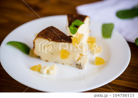 sweet baked cottage cheese casserole with nuts and candied fruits sweet baked cottage cheese casserole with nuts and candied fruits 104786515