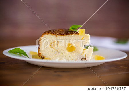 sweet baked cottage cheese casserole with nuts and candied fruits sweet baked cottage cheese casserole with nuts and candied fruits 104786577
