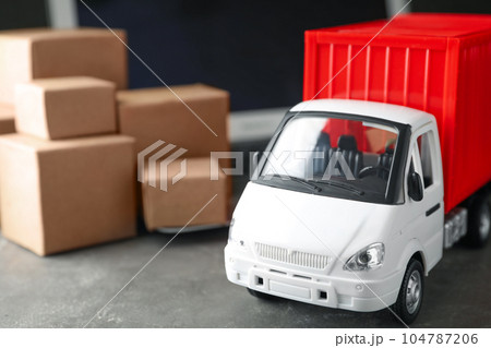Toy truck on table. Logistics and wholesale concept Toy truck on table. Logistics and wholesale concept 104787206