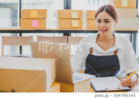 Small business owners online are taking orders and products that their customers have ordered. and check the orders that the customers have ordered of online retailers - online shopping Small business owners online are taking orders and products that their customers have ordered. and check the orders that the customers have ordered of online retailers - online shopping 104790143