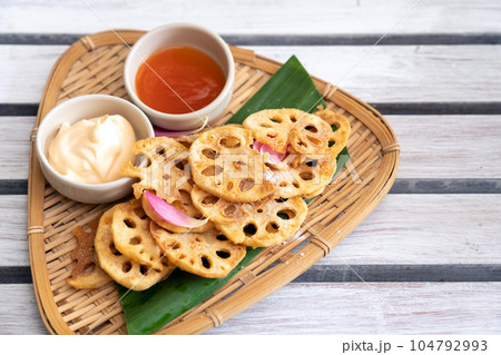 deep fried Lotus root salad with Mayonnaise and Chili Sauce 104792993
