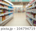 blurred supermarket with shelves 104794719