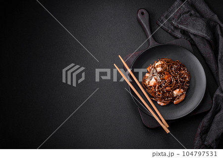 Delicious fresh buckwheat noodles with boiled tiger prawns, salt, spices and mushrooms 104797531