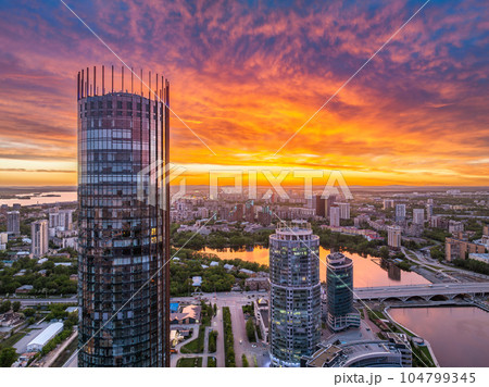 Yekaterinburg skyscraper aerial panoramic view at spring or autumn in clear sunset. Yekaterinburg is the fourth largest city in Russia located on the border of Europe and Asia. Yekaterinburg skyscraper aerial panoramic view at spring or autumn in clear sunset. Yekaterinburg is the fourth largest city in Russia located on the border of Europe and Asia. 104799345