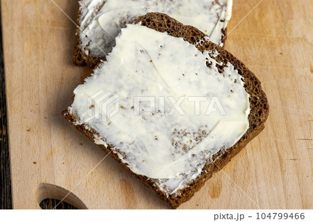 Black rye bread with butter Black rye bread with butter 104799466