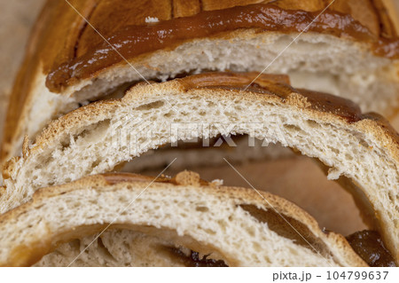 sliced soft fresh wheat pastries with golden crust sliced soft fresh wheat pastries with golden crust 104799637