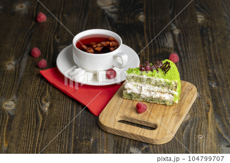 Red raspberry tea with pieces of fruit and berries 104799707