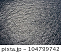 An aerial view of the open sea with textured surface of the water. 104799742