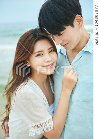 young couple on the beach 104802877