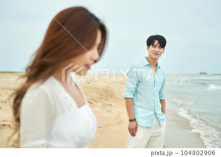 young couple on the beach 104802906