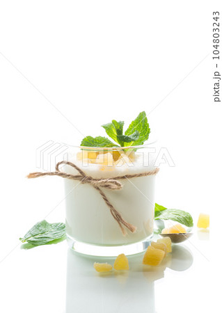 Sweet homemade yogurt with candied fruits in a glass Sweet homemade yogurt with candied fruits in a glass 104803243