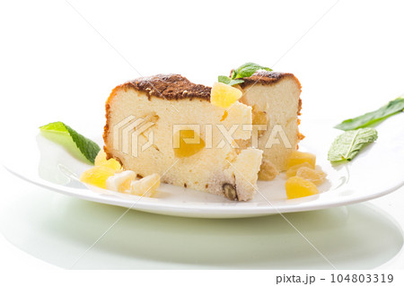 sweet baked cottage cheese casserole with nuts and candied fruits 104803319