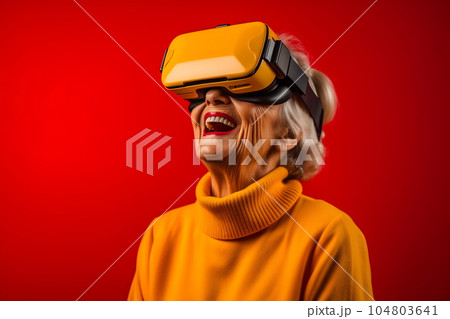 Senior woman having fun with virtual reality glasses. Old people using new headset goggles trends technology 104803641