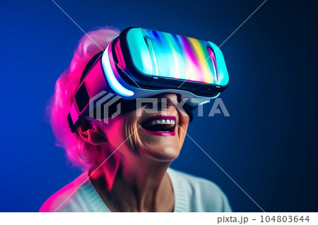 Senior woman having fun with virtual reality glasses. Old people using new headset goggles trends technology 104803644