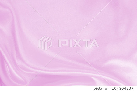Smooth elegant pink silk or satin texture as wedding background. Luxurious background design 104804237