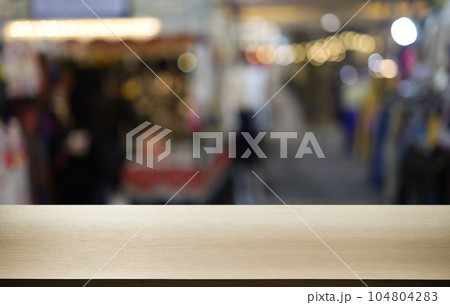 Empty wooden table in front of abstract blurred background of coffee shop . can be used for display or montage your products.Mock up for display of product Empty wooden table in front of abstract blurred background of coffee shop . can be used for display or montage your products.Mock up for display of product 104804283
