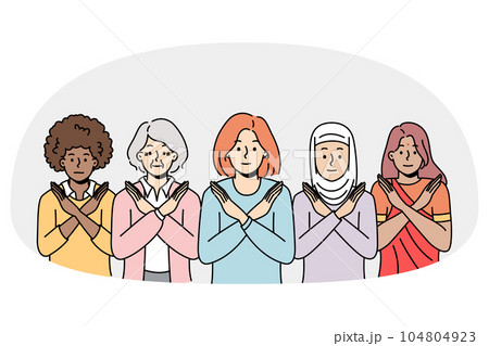 Multiethnic women show stop sign against discrimination 104804923