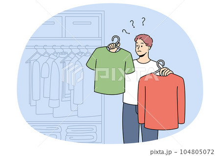 Man choose what to wear in wardrobe 104805072
