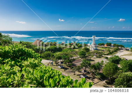 Pandawa beach in Bali. Scenic coastline with lighthouse and blue ocean. 104806818