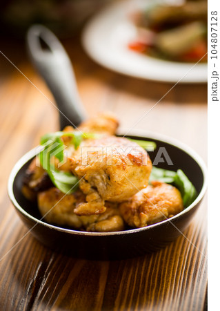 fried pieces of chicken fillet in a pan fried pieces of chicken fillet in a pan 104807128