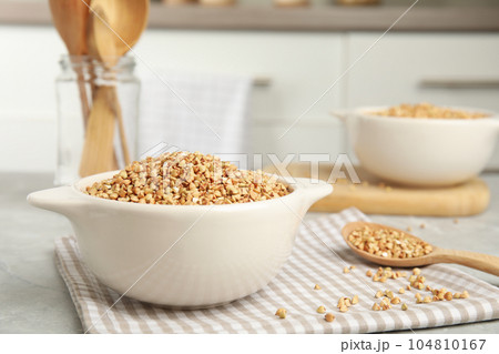 Organic green buckwheat on marble table. Healthy food 104810167