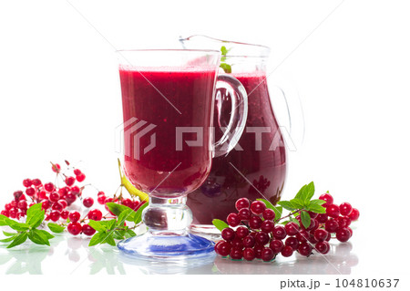 freshly squeezed thick natural juice with pulp from ripe red viburnum in a decanter freshly squeezed thick natural juice with pulp from ripe red viburnum in a decanter 104810637