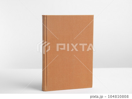Hardcover book on white background. Space for design 104810808