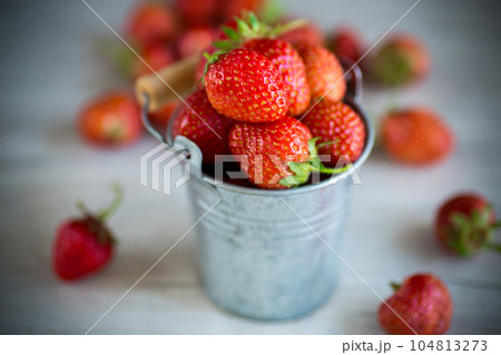 red ripe natural strawberries on a wooden table red ripe natural strawberries on a wooden table 104813273