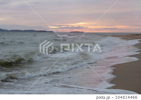 Raging Sea with Sunset Sky Background 104814466