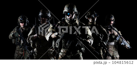 United States Army rangers with assault rifle on dark background United States Army rangers with assault rifle on dark background 104815612