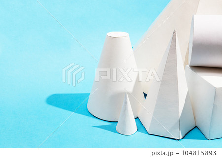 many hand-crafted paper geometric solids close up 104815893