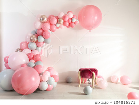 Room decorated with colorful balloons for party 104816573