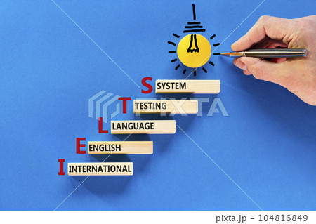 IELTS symbol. Concept words IELTS international english language testing system on wooden block. Beautiful blue background. Business IELTS international english language testing system concept. IELTS symbol. Concept words IELTS international english language testing system on wooden block. Beautiful blue background. Business IELTS international english language testing system concept. 104816849