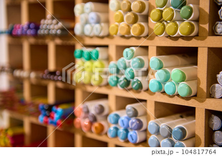 Close-up of watercolor markers and colored felt-tip pens on shelves in a school stationery shop. Office supply store 104817764