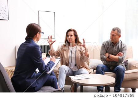 Psychotherapist working with couple in office. Family counselling Psychotherapist working with couple in office. Family counselling 104817869