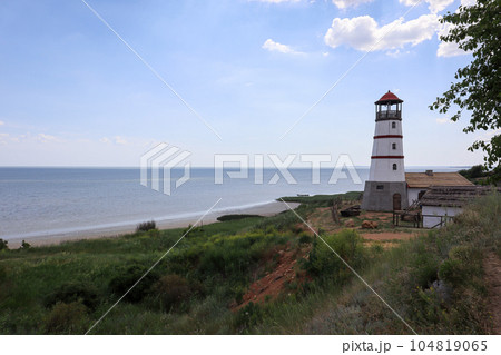 the old lighthouse against the blue sky 104819065