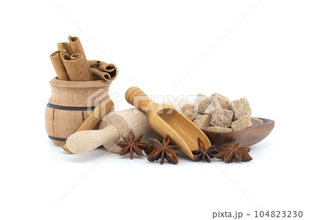 Group of wooden utensils and spices isolated on white background Group of wooden utensils and spices isolated on white background 104823230
