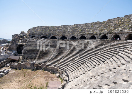 Side Ancient theatre. Turkey. Antalya. Ruins of the ancient city of Side. The largest amphitheater in Turkey. Main street of the ancient city. Mediterranean Sea. Side Ancient theatre. Turkey. Antalya. Ruins of the ancient city of Side. The largest amphitheater in Turkey. Main street of the ancient city. Mediterranean Sea. 104823586