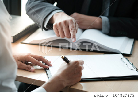 Legal counsel presents to the client a signed contract with gavel and legal law. justice and lawyer concept. Legal counsel presents to the client a signed contract with gavel and legal law. justice and lawyer concept. 104827275