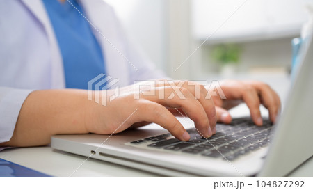 Education profession doctor in white uniform gown coat. Professional medical doctor with tablet and papers at seminar or hospital Coronavirus cancer healthcare 104827292