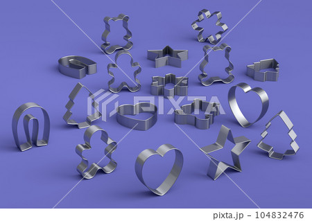Set of metal cookie cutters for homemade Christmas biscuit on a violet Set of metal cookie cutters for homemade Christmas biscuit on a violet 104832476