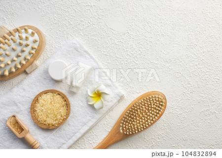 Cosmetic, massage and bath accessories set on white texture background 104832894