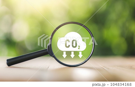 CO2 emission concept. Green industries business concept. Net zero emissions. Magnifying glass with Co2 symbol. Concepts Net Zero Emissions Goals A climate-neutral. 104834168
