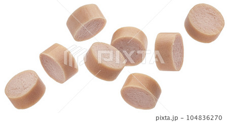 Fallings sausage slices isolated on white background Fallings sausage slices isolated on white background 104836270