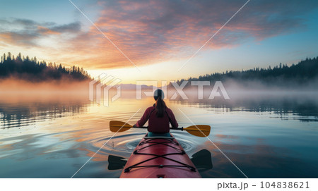 Rear view of a woman navigating her kayak, immersing herself in the beauty of nature. AI generated 104838621