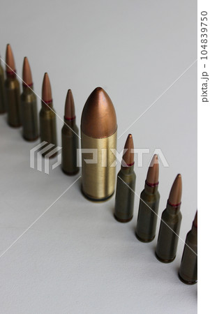 Inclusion And Diversity. Row of same bullets with one big bullet lined out isolated on white 104839750