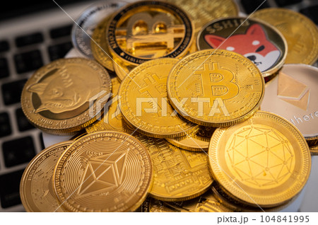 Close up of various kinds of Cryptocurrency token coins. Cryptocurrency is a digital or virtual currency that is secured by cryptography. 104841995