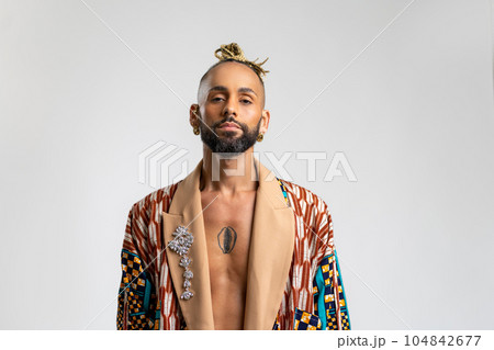 Black Gay Man in Colorful Jacket Isolated on White 104842677